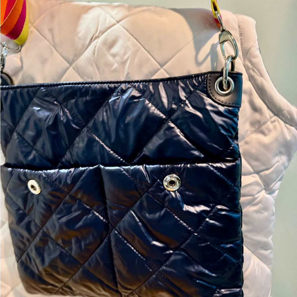 Navy blue cross body puffer style bag only used once